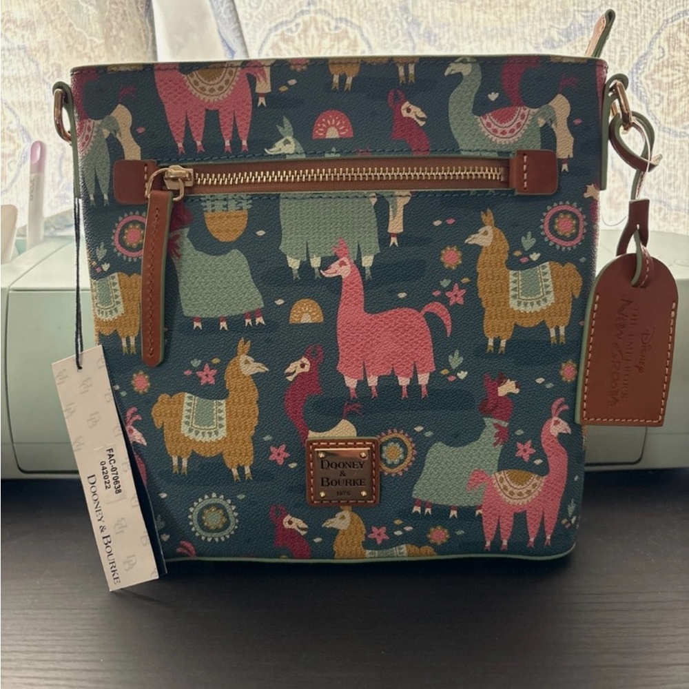 Disney The Emperor's New Groove Blue and Brown Dooney and Bourke Crossover bag.